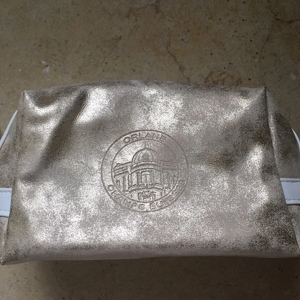 Gold distressed Orlane Paris makeup/cosmetic bag